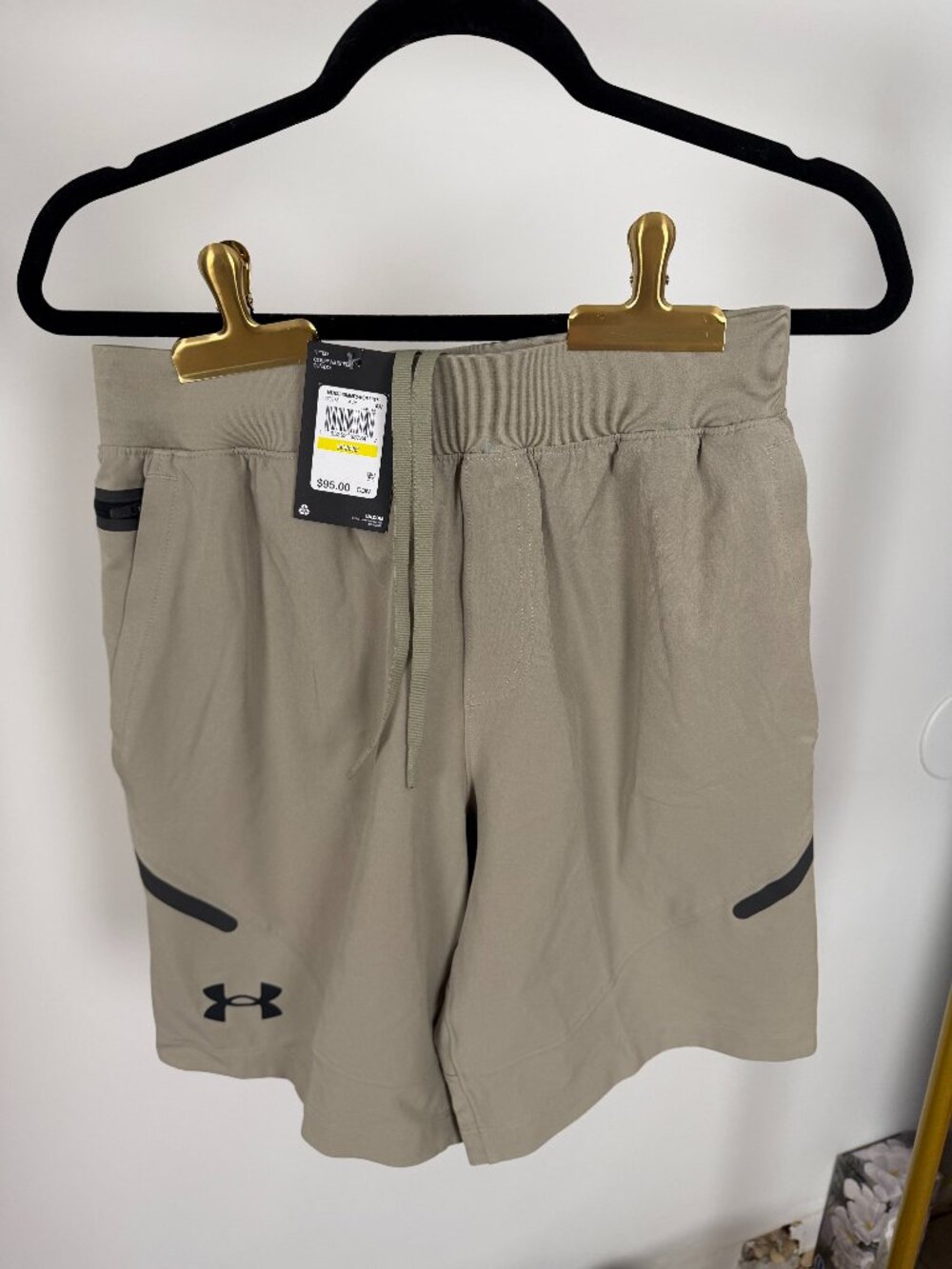 Under Armour STORM.  Men's Medium Fitted Shorts.  Tan and black.